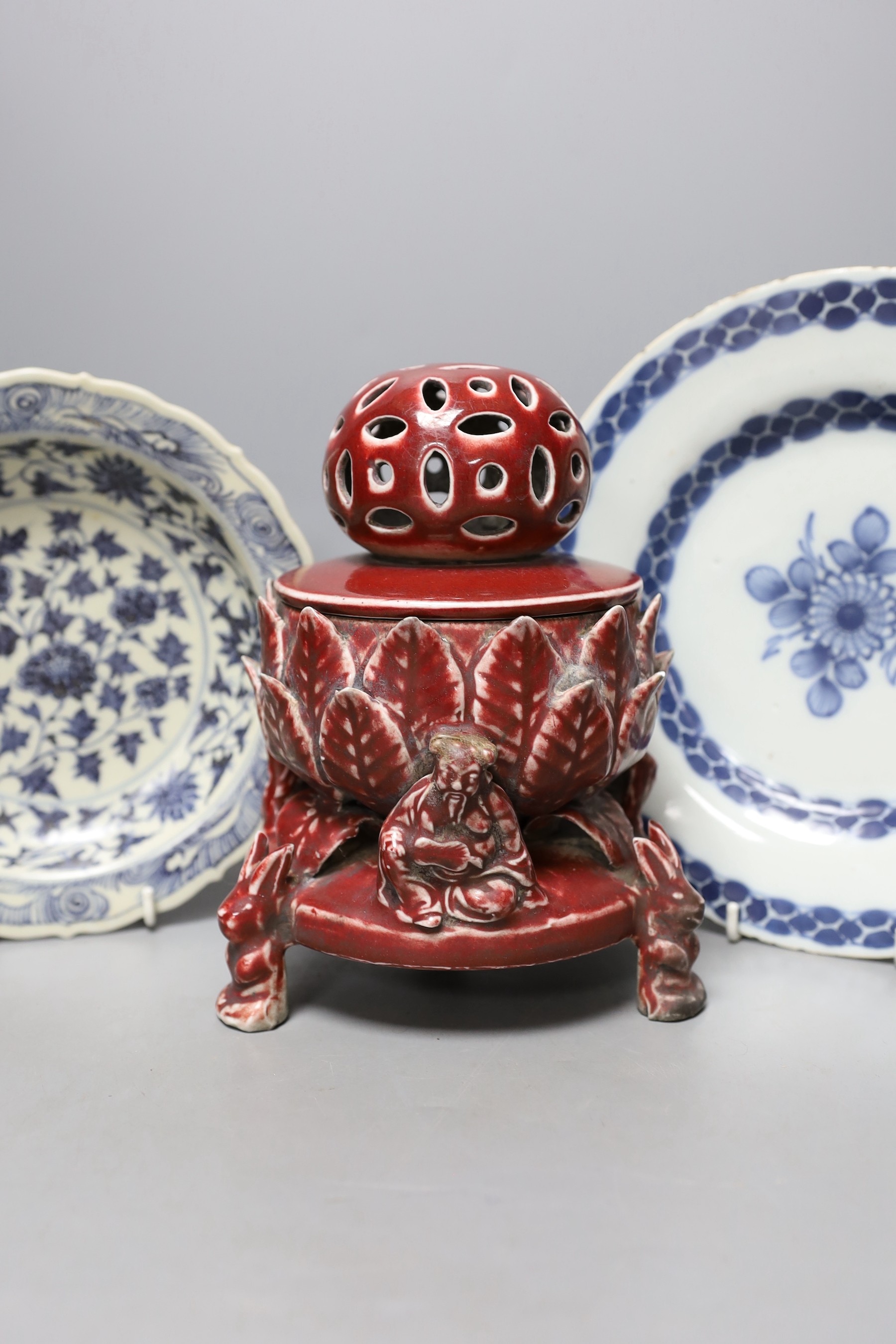 A Chinese sang-de-boeuf glazed pottery incense burner, 21cm high, s similar blue and white bowl and a famille rose footed dish together with a Delft plate.